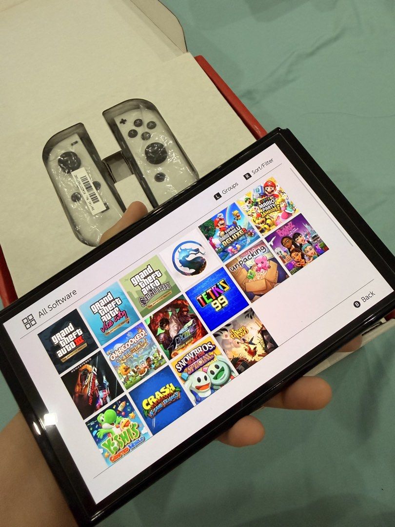 Nintendo switch oled Jailbreak (Category: Nintendo) located in Antipolo. Submitted by guchilove (Listing ID 1466772288, Image 2). Description: Nintendo switch oled Jailbreak With 256gb MIGFLASH. Full of games Complete with box HDMI Dock Grip Strap Charger Good as brandnew. 100% Smooth 📍Antipolo loc pm sa interested .