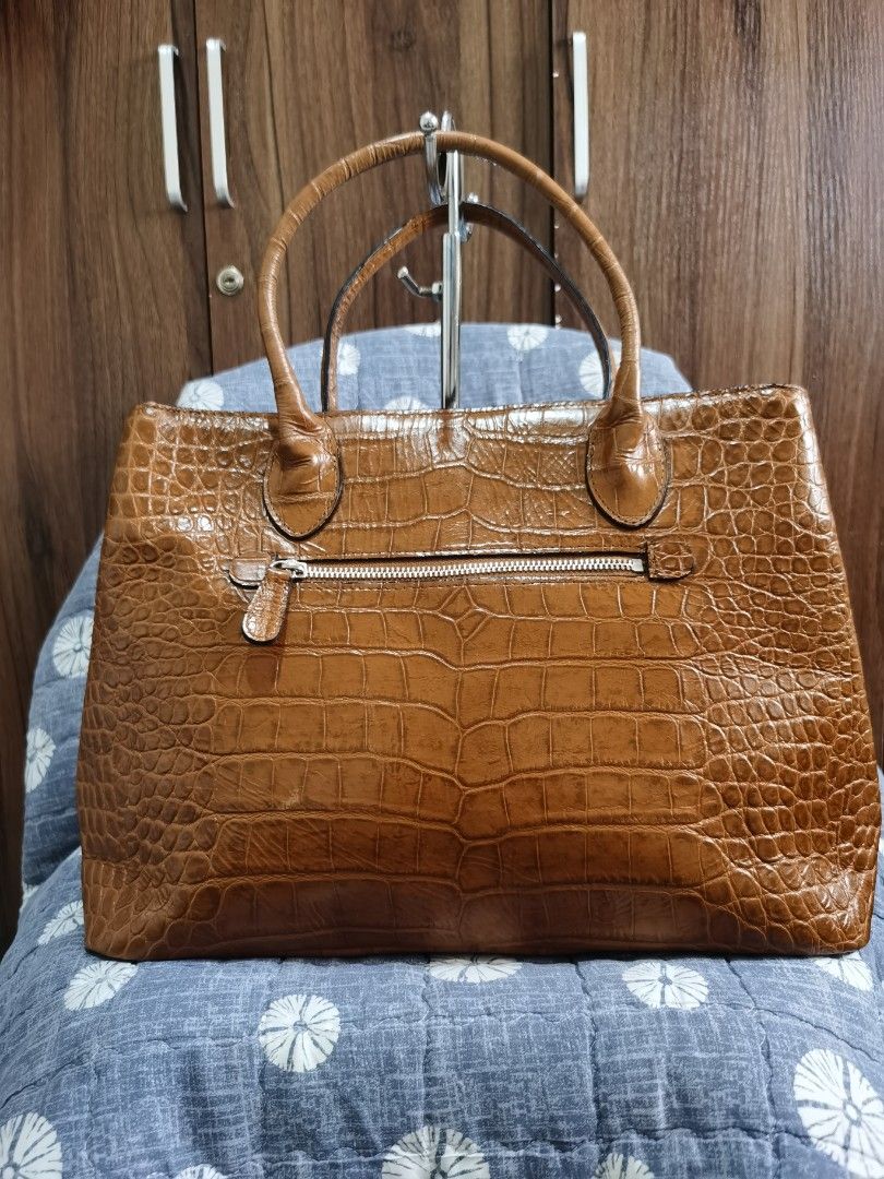 OFFICE BAG (Category: Tote Bags) located in Bacolod City. Submitted by mzb06 (Listing ID 1466593369, Image 2). Description: Embossed crocodile skin material, structure design, has 3 clean & spacious compartment. Excellent usable condition. Detailed pictures posted for reference.large in size.very elegant in actual..