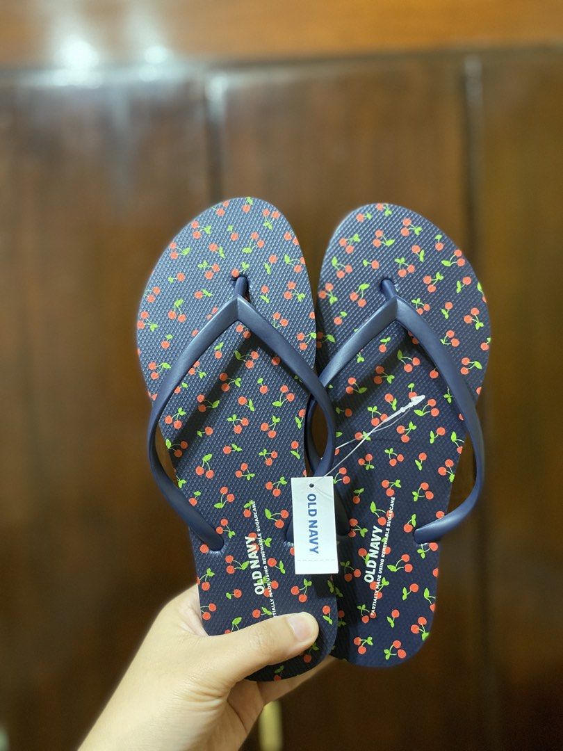 Old Navy Flip Flops Cherry and Stripe Pairs US6 (Category: Slippers and slides) located in Batangas. Submitted by lux_kimmy (Listing ID 1466674580, Image 3). Description: - Brand: Old Navy - Quantity: 2 pairs - Condition: Brand new with tags attached (Never worn) - Pair 1: Navy blue base with red cherry all-over print - Pair 2: Blue and white vertical stripes - Ideal for: Beach trips, vacations, and casual warm-weather wear US 6 (Both) ₱250 each 