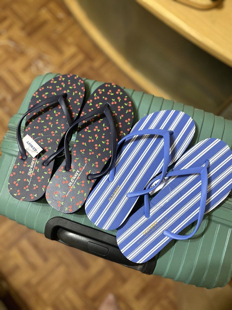 Old Navy Flip Flops Cherry and Stripe Pairs US6 (Category: Slippers and slides) located in Batangas. Submitted by lux_kimmy (Listing ID 1466674580, Image 1). Description: - Brand: Old Navy - Quantity: 2 pairs - Condition: Brand new with tags attached (Never worn) - Pair 1: Navy blue base with red cherry all-over print - Pair 2: Blue and white vertical stripes - Ideal for: Beach trips, vacations, and casual warm-weather wear US 6 (Both) ₱250 each 
