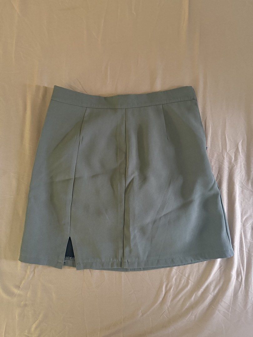 Olive Green/Brownish Skort (Category: Skirts) located in Pasay City. Submitted by cheyennesayson (Listing ID 1466572855, Image 1). Description: - Size: Medium (M) - waist 26-27 - Material & Design: Structured fabric with front seam details and a subtle side slit - Comfort & Coverage: Built-in black lining underneath for extra confidence - Closure: Convenient side zipper - Versatility: Clean cut, perfect for casual outings or paired with blouses f