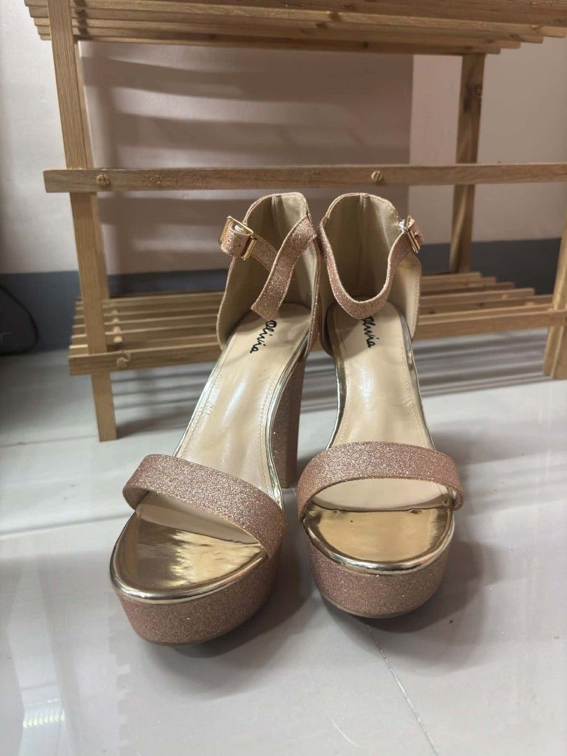 Olivia Rose Gold Glitter Platform Heels Ankle Strap (Category: Heels) located in Mandaluyong City. Submitted by zedchu (Listing ID 1466681307, Image 3). Description: - Brand/Style: Olivia rose gold glitter platform heels - Heel & Sole: Chunky block heel with a thick platform for extra comfort - Details: Adjustable ankle strap with buckle closure and chic metallic gold inner lining - Condition: Worn only a few times with minimal wear on the soles 