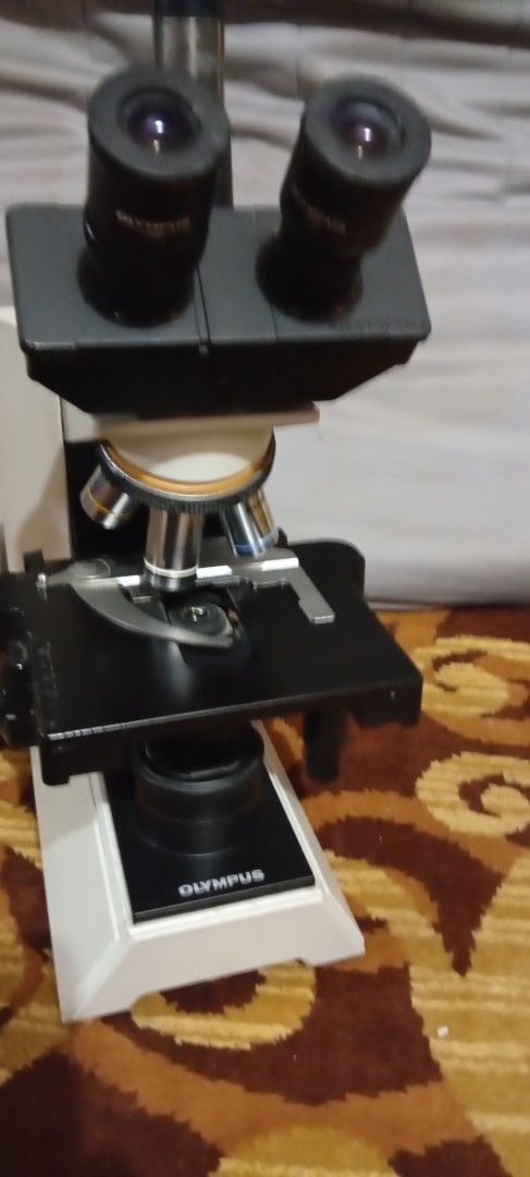Olympus CH40 Microscope made in Japan (Category: Medical Supplies & Tools) located in Cabanatuan. Submitted by 09497369055 (Listing ID 1466576120, Image 3). Description: OLYMPUS CH40 USED IN GOOD WORKING CONDITION ISSUE..SCRATCH AND SLIGHT PAINT FADED DOES NOT AFFECT THE PERFORMANCE - Brand: Olympus - Model: CH40 Binocular Microscope - Condition: Fully intact, heavy laboratory equipment with standard wiring - Features: Multiple objective lenses, 