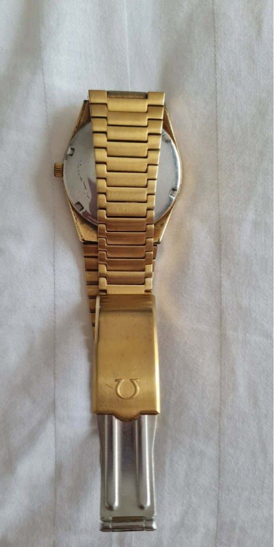 Omega Geneve Automatic Gold Dial Watch (Category: Men's Watches) located in Imus. Submitted by juantosell777 (Listing ID 1466640052, Image 2). Description: - Brand/Model: Vintage Omega Geneve Automatic Watch - Dial: Striking blue dial with date window at 3 o'clock - Case & Bracelet: Gold-tone case with integrated bracelet and stainless steel case back - Performance: Keeps time well and ready for daily wear.