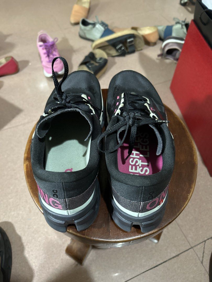 On Cloudmonster Hyper Black Pink Running Shoes (Category: Sneakers) located in Alitagtag. Submitted by patrickvillanueva (Listing ID 1466601465, Image 2). Description: On Cloudmonster Hyper running shoes in black with bright pink lettering and light green accents. Swiss engineering, Helion foam soles, big cushioning. Bold 'ON RUNNING' text printed across the outer sides. Inside tag says Fresh Legs. Very clean uppers, minimal wear on soles. Great 