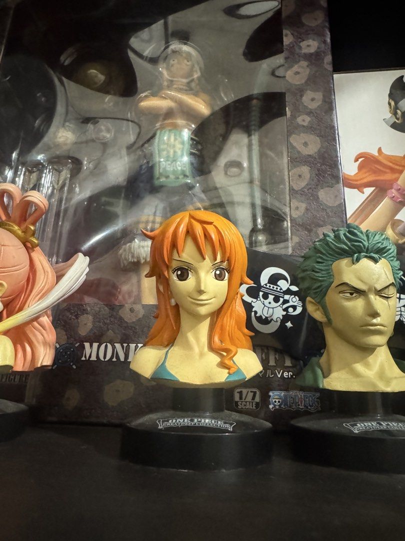 One Piece Greatdeep Collection Character Bust Figures Set (Category: Figurines & Statues) located in Marikina City. Submitted by thepuzzlepiececollection (Listing ID 1466654166, Image 3). Description: - Set of 5 One Piece bust figures from the Greatdeep Collection - Includes Luffy, Sanji, Zoro, Nami, and Princess Shirahoshi - Each figure features a black stand with a mini Jolly Roger pirate flag background - Highly detailed sculpting and paintwor