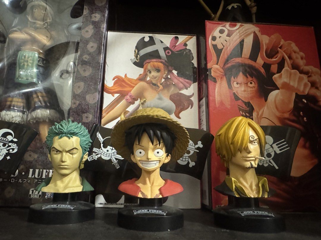 One Piece Greatdeep Collection Character Bust Figures Set (Category: Figurines & Statues) located in Marikina City. Submitted by thepuzzlepiececollection (Listing ID 1466654166, Image 2). Description: - Set of 5 One Piece bust figures from the Greatdeep Collection - Includes Luffy, Sanji, Zoro, Nami, and Princess Shirahoshi - Each figure features a black stand with a mini Jolly Roger pirate flag background - Highly detailed sculpting and paintwor