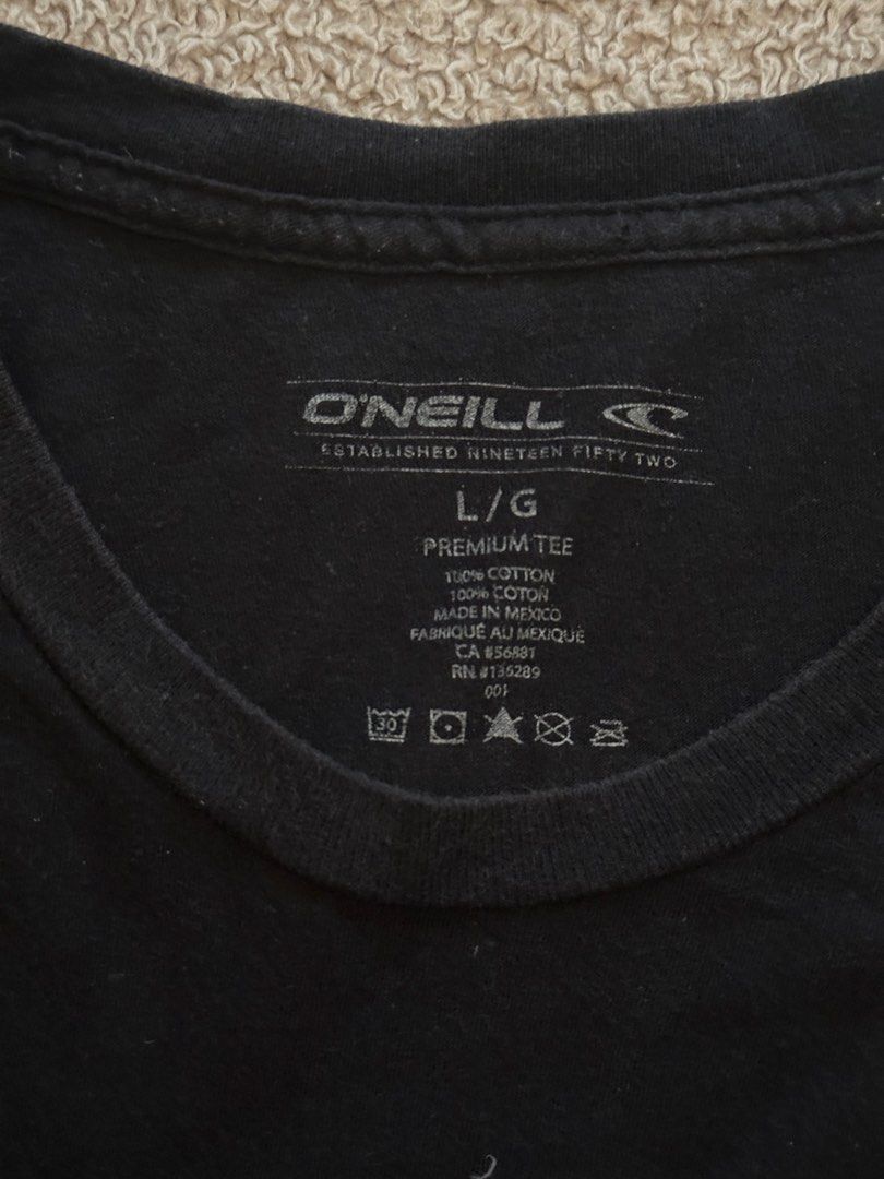O'Neill Black Logo Premium Tee Size Large (Category: Tshirts & Polo Shirts ) located in Quezon City. Submitted by mancave_stuff (Listing ID 1466568030, Image 3). Description: - Brand: O'Neill - Color: Black - Size: L (Large) W21” x L29” - Material: 100% cotton, made in Mexico - Design: Small oval chest logo and large distressed back graphic with 'Since 1952' - Details: Woven hem tag and tagless printed neck label for extra comfort .
