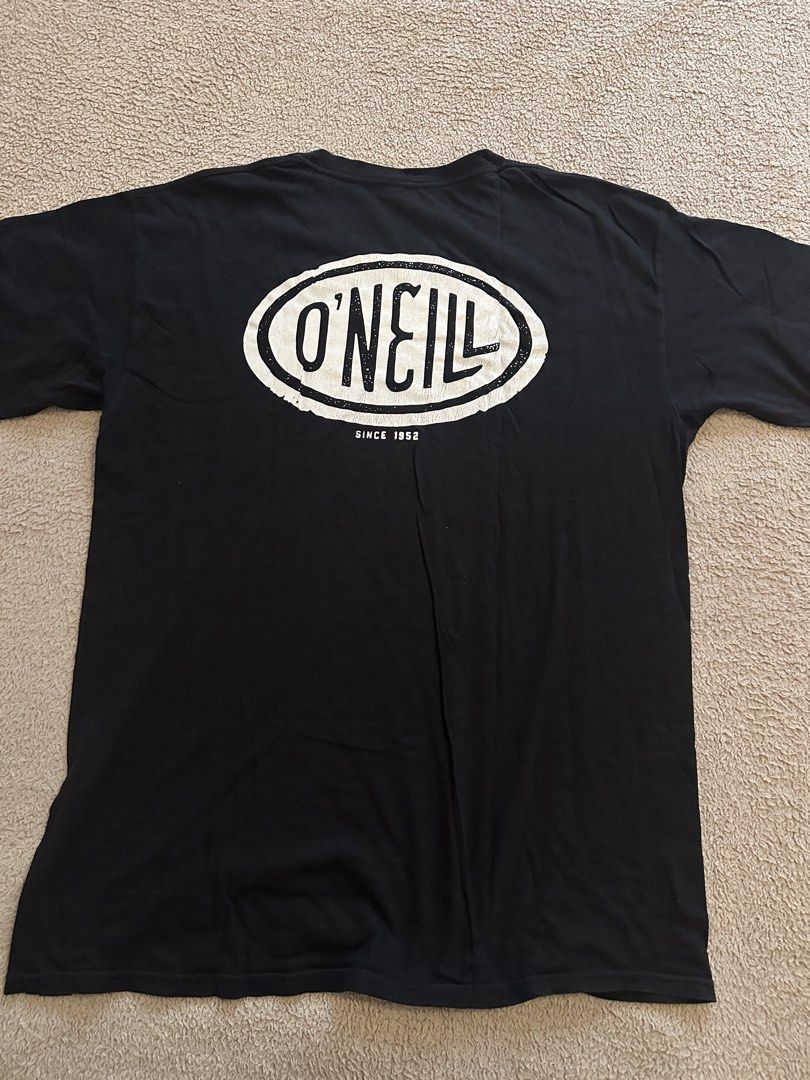 O'Neill Black Logo Premium Tee Size Large (Category: Tshirts & Polo Shirts ) located in Quezon City. Submitted by mancave_stuff (Listing ID 1466568030, Image 2). Description: - Brand: O'Neill - Color: Black - Size: L (Large) W21” x L29” - Material: 100% cotton, made in Mexico - Design: Small oval chest logo and large distressed back graphic with 'Since 1952' - Details: Woven hem tag and tagless printed neck label for extra comfort .