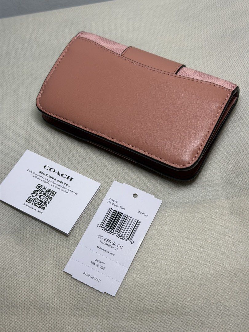 Original Coach Essential Slim Card Case (Category: Wallets & Card holders) located in Marikina City. Submitted by welllovedbycarina (Listing ID 1466762449, Image 2). Description: 🍬 Guaranteed original 🍬 Coach Essential Slim Card Case 🍬 Melon Pink color 🍬 May crease na po talaga sa folded part when I received it from the store. Pero hindi po sya damage 🙂 🍬 Ready to ship from Marikina City 🍬 Hardware: Gold-tone 🍬 Features: Snap closure, car