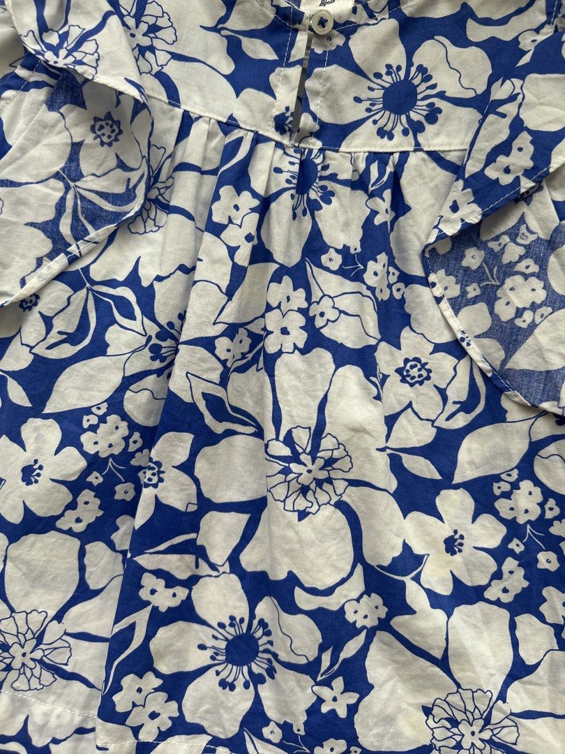 OshKosh B'gosh top (Category: Babies & Kids Fashion) located in Cebu City. Submitted by yjainani (Listing ID 1466668585, Image 2). Description: OshKosh B'gosh blue and white floral-print sleeveless ruffle top for girls.