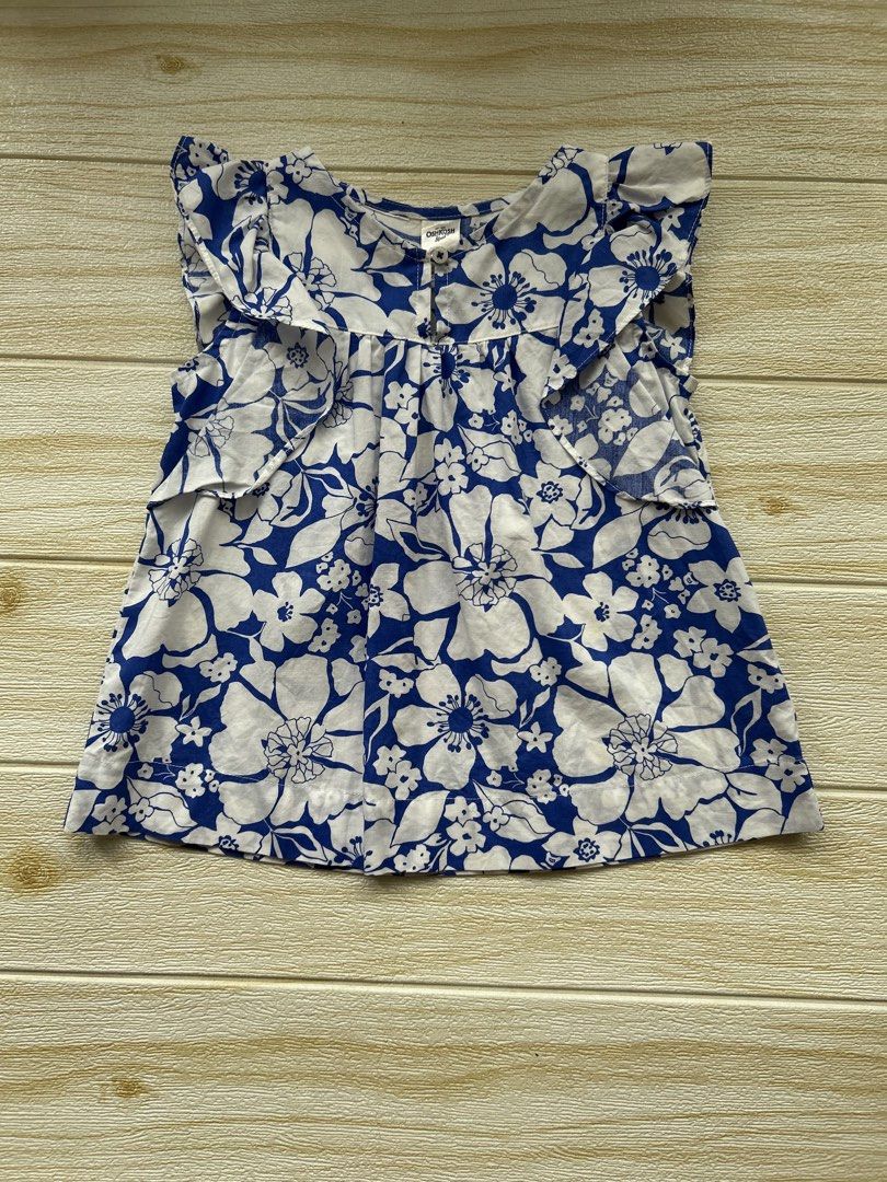 OshKosh B'gosh top (Category: Babies & Kids Fashion) located in Cebu City. Submitted by yjainani (Listing ID 1466668585, Image 1). Description: OshKosh B'gosh blue and white floral-print sleeveless ruffle top for girls.
