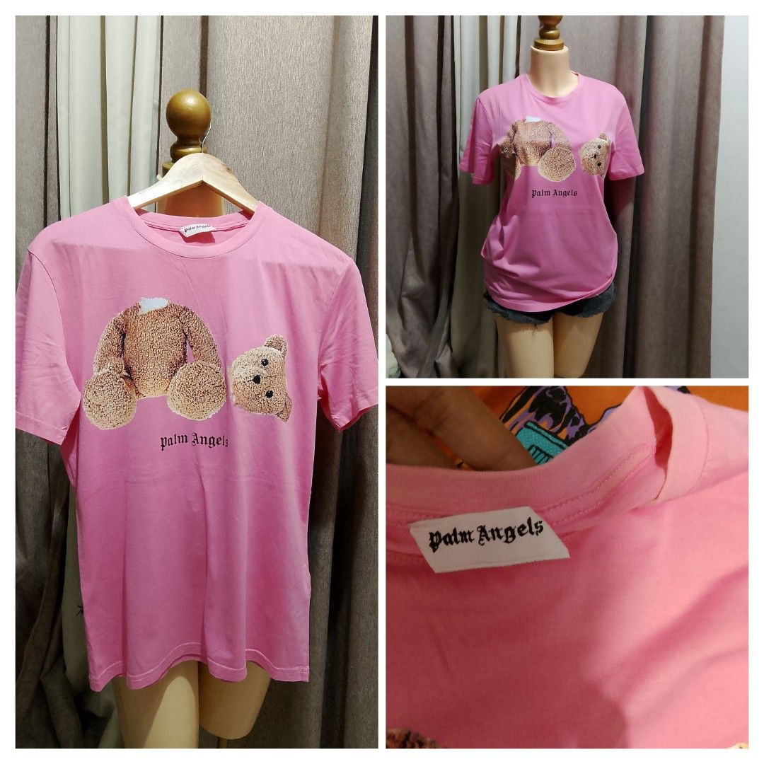 Palm Angels Pink Bear T-Shirt (Category: Shirts) located in Caloocan City. Submitted by wirlynbina94604 (Listing ID 1466735798, Image 1). Description: - Brand: Palm Angels - Color: Bright pink - Design: Iconic headless teddy bear graphic with bold black branding on the front - Fit: Classic crew neck, short sleeves - Material: Soft, high-quality cotton - Details: Authentic white interior neck label - Condition: Vibrant color, excellent quality.