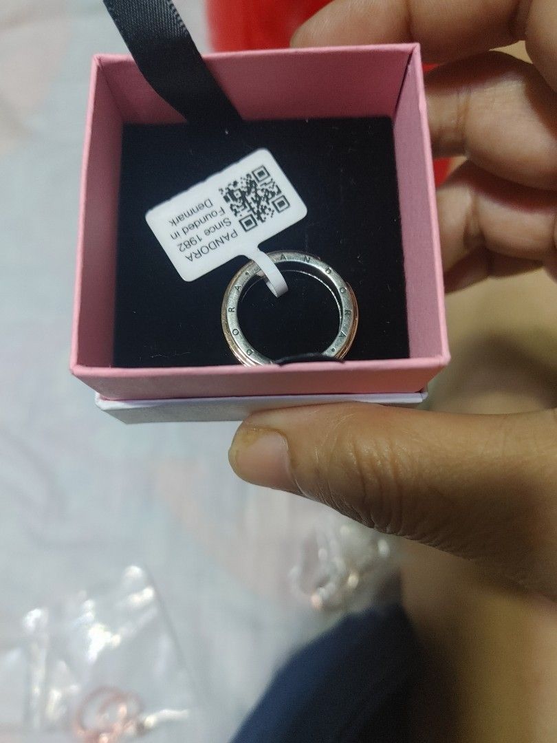 Pandora Two-Tone Pave Ring with Box (Category: Rings) located in Pasig City. Submitted by magic5 (Listing ID 1466686204, Image 3). Description: - Authentic Pandora two-tone ring with sparkling pave crystals - Features engraved brand name along the outer edge - Brand new, never worn, with original tag attached - Comes with a lovely pink Pandora gift box - Ideal for gifts or personal collection - PM for inquiries or fast shipping!.