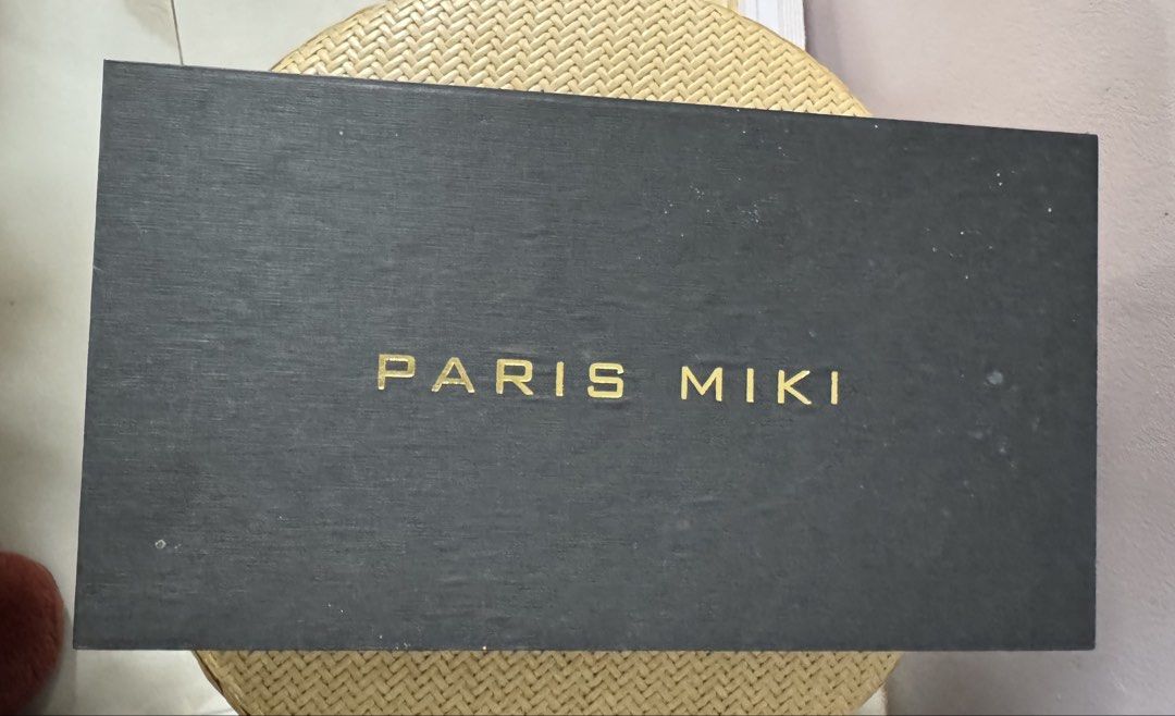 PARIS MIKI Original Eyeglasses Case / Box (Category: Luxury Accessories) located in Paranaque City. Submitted by joyjoygeneral.merchandise (Listing ID 1466605979, Image 1). Description: Original PARIS MIKI eyeglasses case with black exterior and gold PARIS MIKI lettering. Features a fitted black interior suitable for eyeglasses or sunglasses storage. Condition: Good pre-loved condition Price: ₱1 ,150 negotiable 📦 Case/box only – eyewear not incl