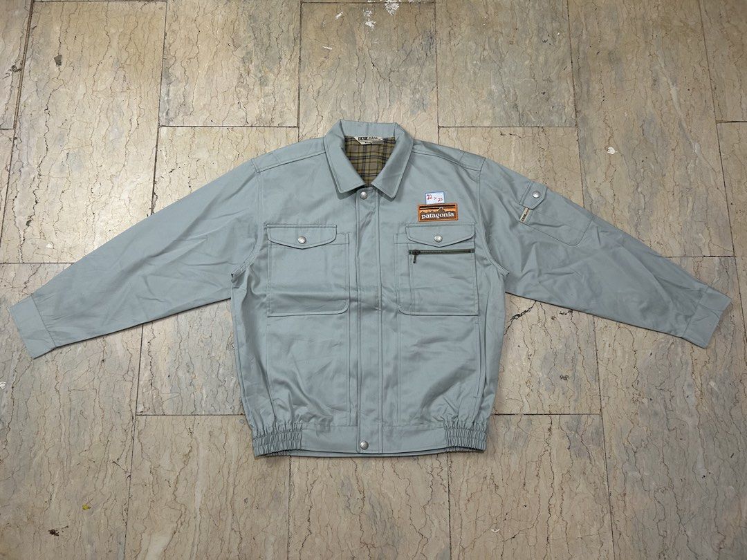 Patagonia Blue Work Jacket With Patch (Category: Coats, Jackets and Outerwear) located in Mandaluyong City. Submitted by 0lg2026 (Listing ID 1466750480, Image 2). Description: - Brand: Patagonia - Color: Deep blue - Style: Work jacket with classic collar and banded hem - Features: Front pockets, button closure, and sturdy daily-wear construction - Fit/Details: Tag includes exact sizing measurements - Ideal for: Layering and casual streetwear.
