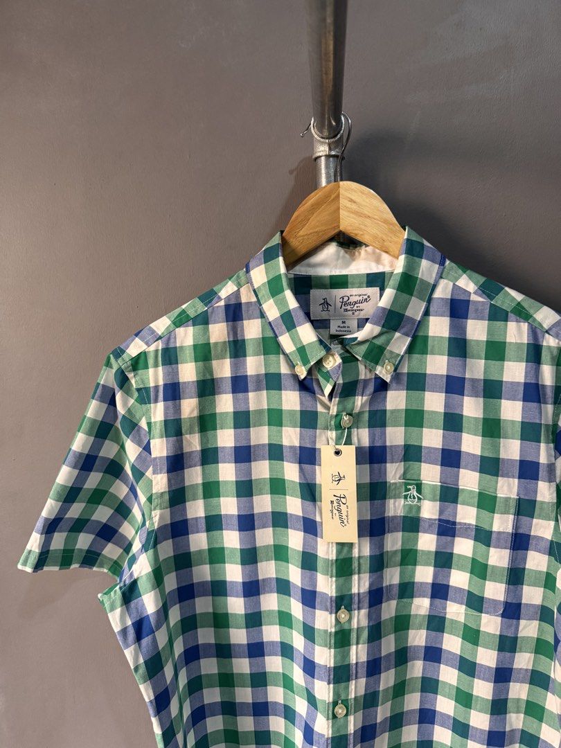 Penguin - Button Up shirt (Category: Activewear) located in Cabuyao City. Submitted by _streetflavor (Listing ID 1466616087, Image 3). Description: Penguin - Button Up shirt Excellent Size: Medium Length: 28 Width: 21.5 -980 pesos Dm.