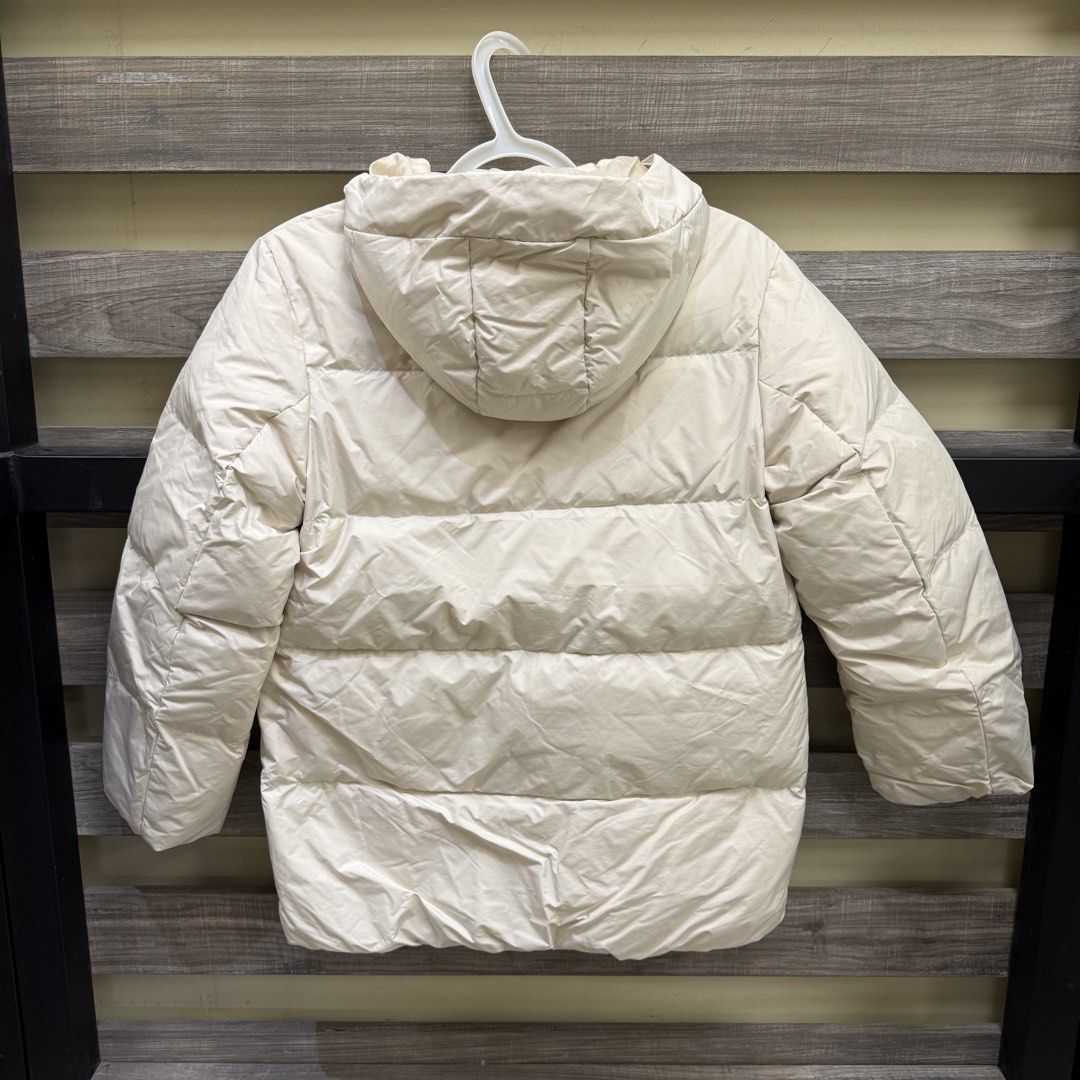 [Petite] Uniqlo White Padded Jacket (Category: Coats, Jackets and Outerwear) located in Mandaluyong City. Submitted by bestdressedph2025 (Listing ID 1466670526, Image 2). Description: MOP: GCash MOD: Lalamove/J&T LOCATION: Brgy. Addition Hills, Mandaluyong Discount avail for multiple items. Dimensions in Inches: Shoulder: 17 Bust: 19 Length: 26 Size on Tag: 150 PM for inquiries!.