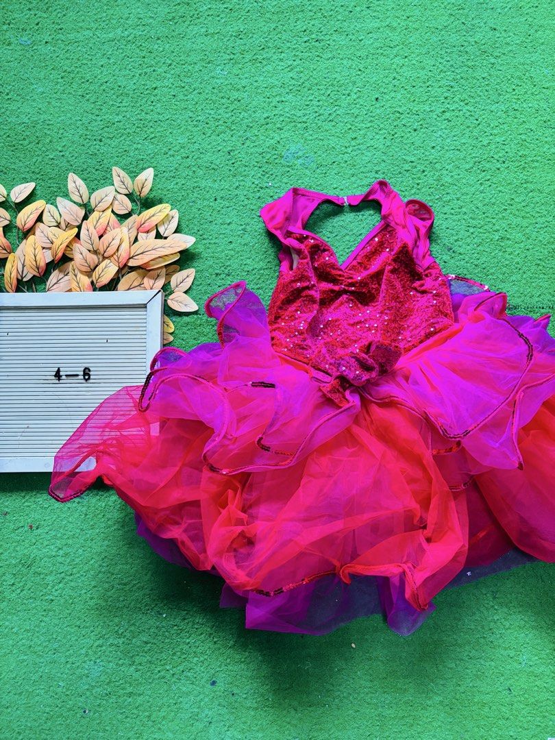 Pink and Red Sequin Layered Dance Costume (Category: Babies & Kids Fashion) located in San Mateo. Submitted by ariakid47 (Listing ID 1466627017, Image 1). Description: - Color: Vibrant bright pink and red - Size: Kids 4 to 6 years old - Design: Sparkly sequin bodice and stylish open back with neck clasp closure - Skirt: Fluffy multi-layered tulle with dark trim edges - Ideal for: Dance recitals, stage performances, and fun dress-up play - Conditi