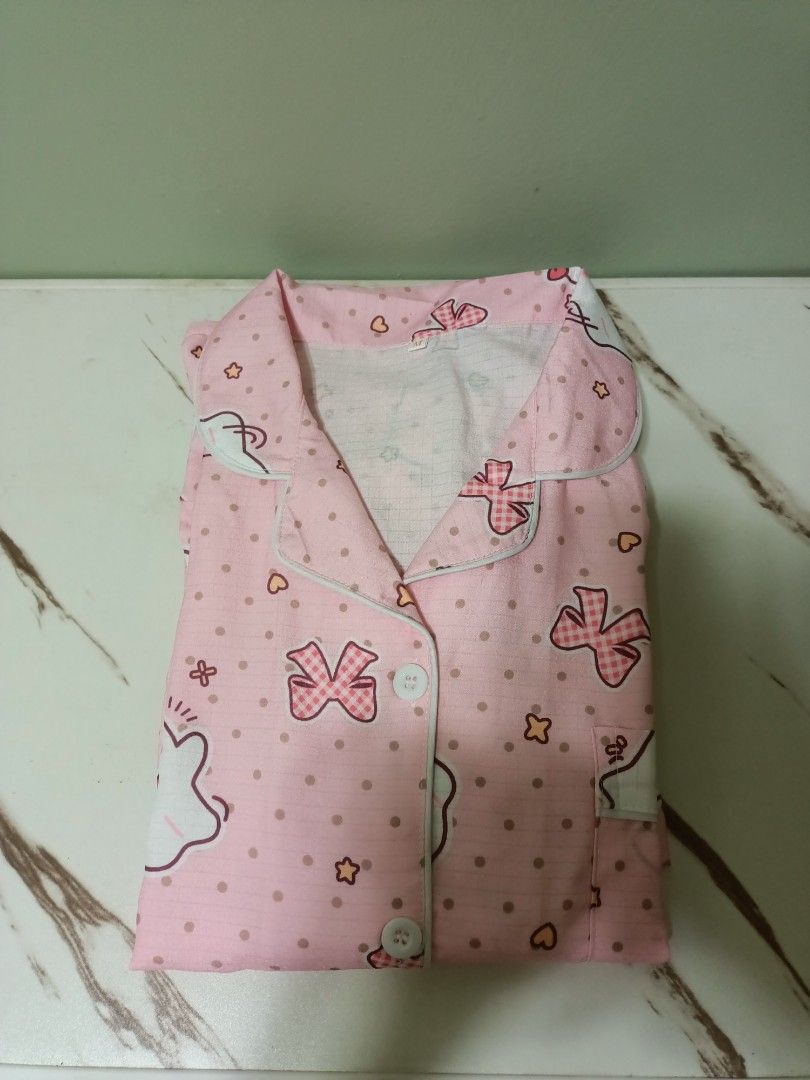 Pink Ghost Print Short Sleeve Pajama Set (Category: Undergarments & Loungewear) located in Antipolo. Submitted by cathrift_ (Listing ID 1466721026, Image 2). Description: short sleeve polo + short.