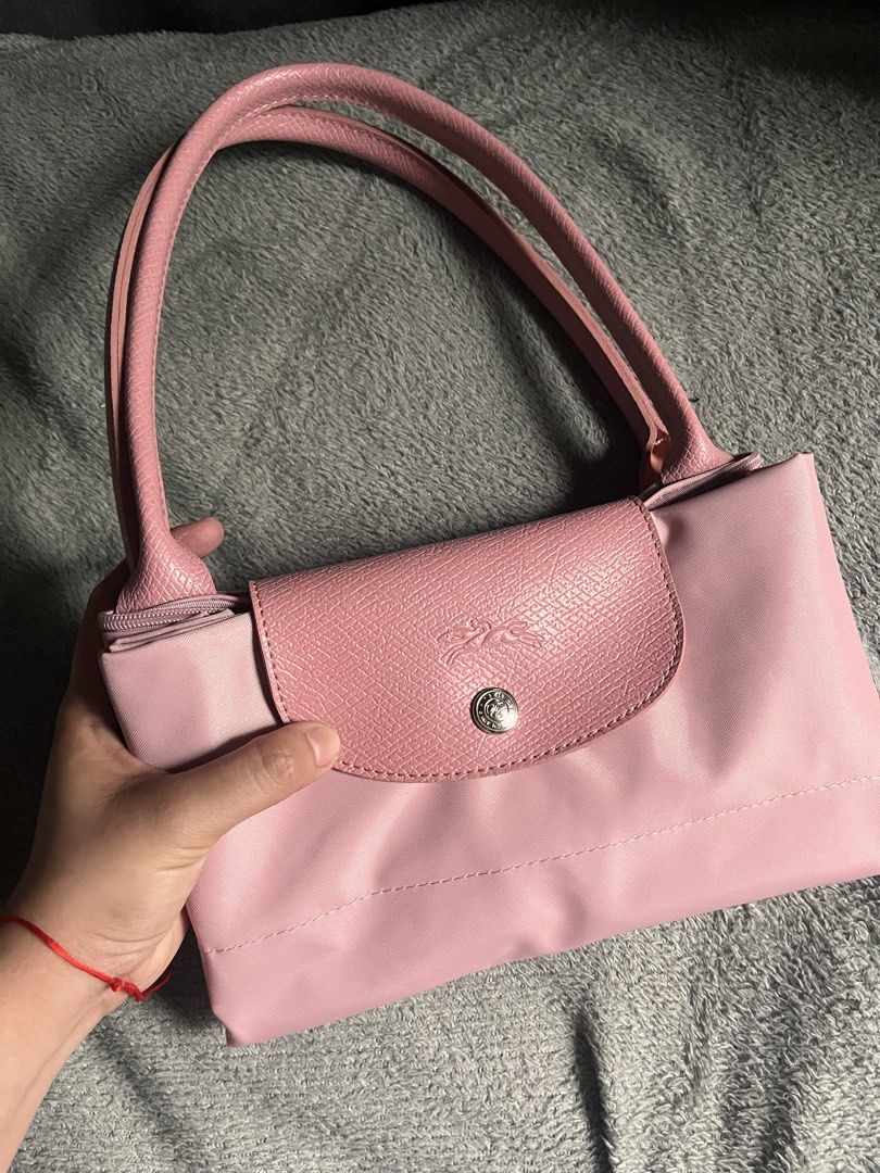 Pink Longchamp Long handle (Category: Tote Bags) located in San Jacinto. Submitted by kellysthrift_ (Listing ID 1466611097, Image 1). Description: Longchamp in pink longhandle Good condition, Used but not abused! Message me if interested.
