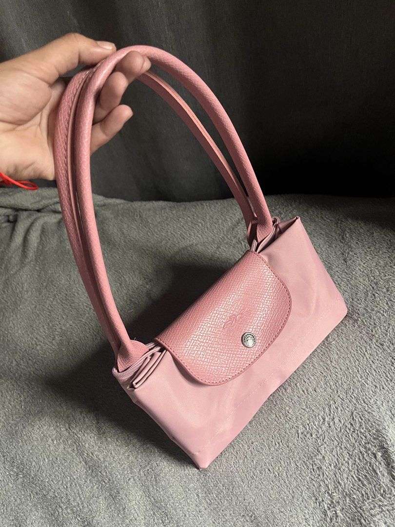 Pink Longchamp Long handle (Category: Tote Bags) located in San Jacinto. Submitted by kellysthrift_ (Listing ID 1466611097, Image 2). Description: Longchamp in pink longhandle Good condition, Used but not abused! Message me if interested.