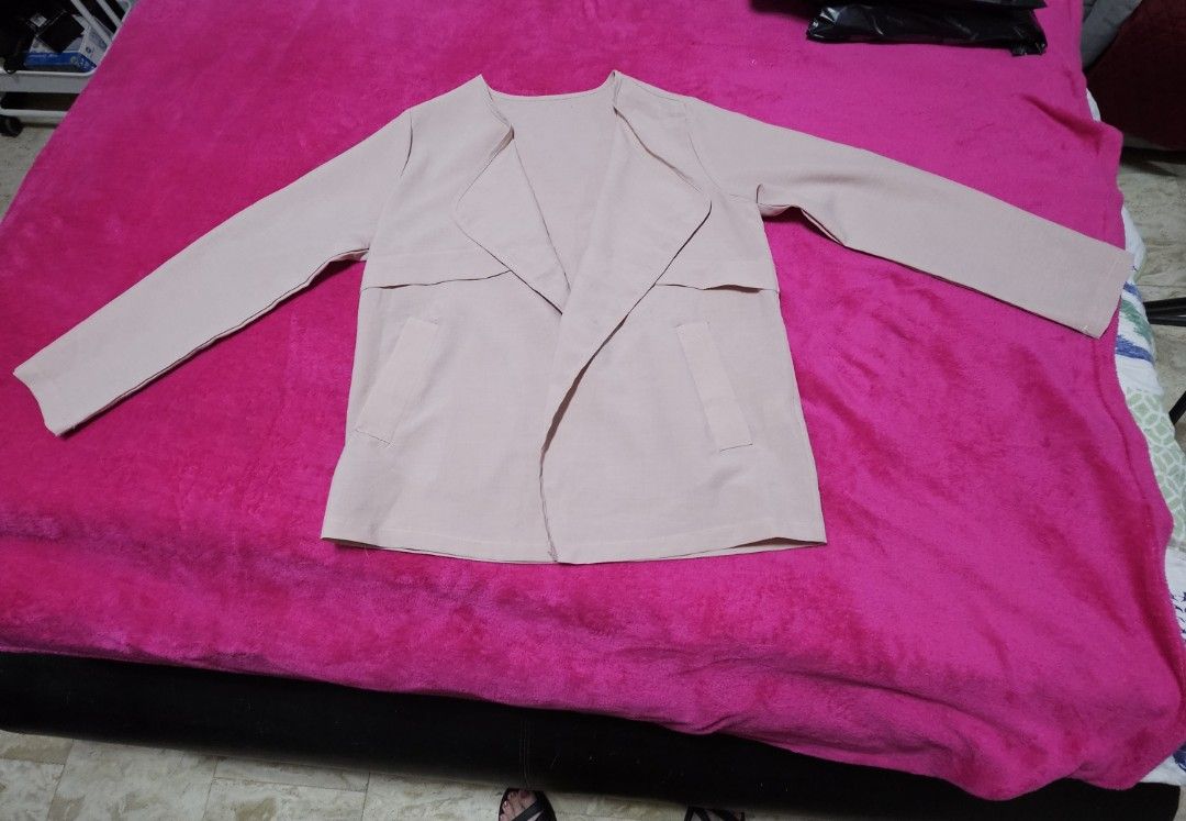 Pink Open Front Blazer Jacket with Pockets (Category: Coats, Jackets and Outerwear) located in Caloocan City. Submitted by rm.diaz (Listing ID 1466609436, Image 3). Description: - Color: Dusty pink - Style: Open front lightweight blazer - Details: Lapel collar, two front pockets, clean back seam - Sleeves: Long sleeves with adjustable button tab details - Versatility: Easy to match and great for layering over tops or dresses.