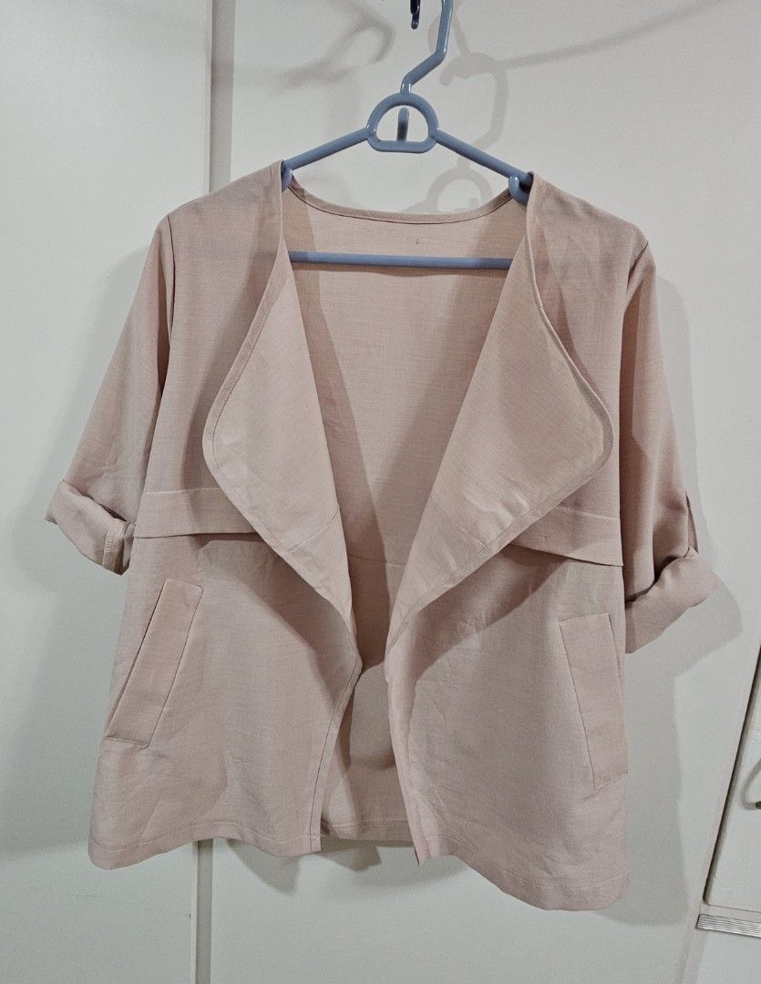 Pink Open Front Blazer Jacket with Pockets (Category: Coats, Jackets and Outerwear) located in Caloocan City. Submitted by rm.diaz (Listing ID 1466609436, Image 2). Description: - Color: Dusty pink - Style: Open front lightweight blazer - Details: Lapel collar, two front pockets, clean back seam - Sleeves: Long sleeves with adjustable button tab details - Versatility: Easy to match and great for layering over tops or dresses.