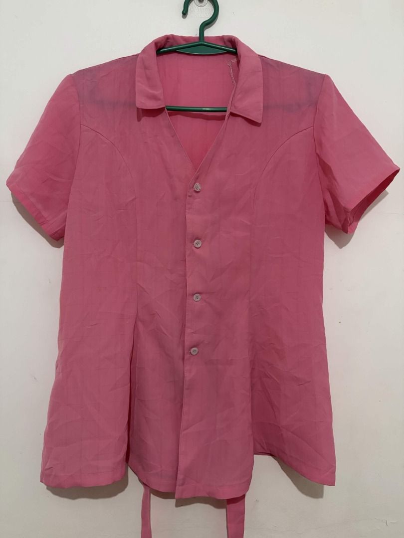 Pink Short Sleeve Collared Blouse | Tie-Back Office Top (Category: Blouses) located in Quezon City. Submitted by gonzotrickster9899 (Listing ID 1466661171, Image 1). Description: Selling this versatile pink button-down top, perfect for office wear or everyday casual outfits. - Features a neat collar, front buttons, and waist ties at the back to easily adjust the silhouette. - The color is a vibrant solid pink. - Gently used, no noticeable flaws o