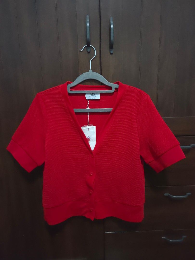 Plain & Prints Jeiska Red Cardigan Size S (Category: Coats, Jackets and Outerwear) located in Quezon City. Submitted by sashasarisarishoppe (Listing ID 1466668715, Image 1). Description: - Brand: Plain & Prints - Item: Short sleeve cardigan - Color: Bright red - Size: Small (S) - Condition: Brand new with tags (BNWT), never worn - Details: V-neck, button-down front, ribbed texture, and folded sleeve cuffs - Original Retail Price: PHP 1,598.00.