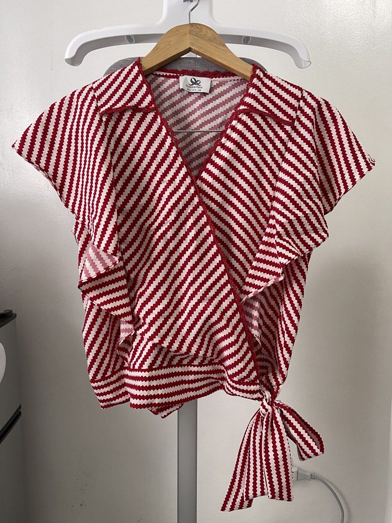 Plains & Prints Red and White Wrap Top (Category: Blouses) located in Bacoor. Submitted by lavanderpeach (Listing ID 1466618835, Image 2). Description: - Large size (please see size chart in the photos attached) - washed but unused; RFS - decluttering - Payment first via e-wallet/bank transfer - Pick up at my house (Molino IV) or via lalamove c/o buyer.