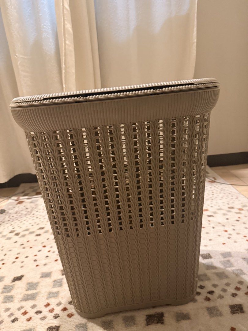 Plastic Rattan Style Laundry Basket with Lid (Category: Laundry Baskets) located in Mandaluyong City. Submitted by riz_040521 (Listing ID 1466610552, Image 1). Description: - Chic beige laundry hamper with a trendy woven rattan texture - Includes a matching hinged lid to keep clothes neatly out of sight - Built-in cutout handles on the sides for effortless carrying - Ventilated slat design promotes good airflow and prevents odors - Ideal size for