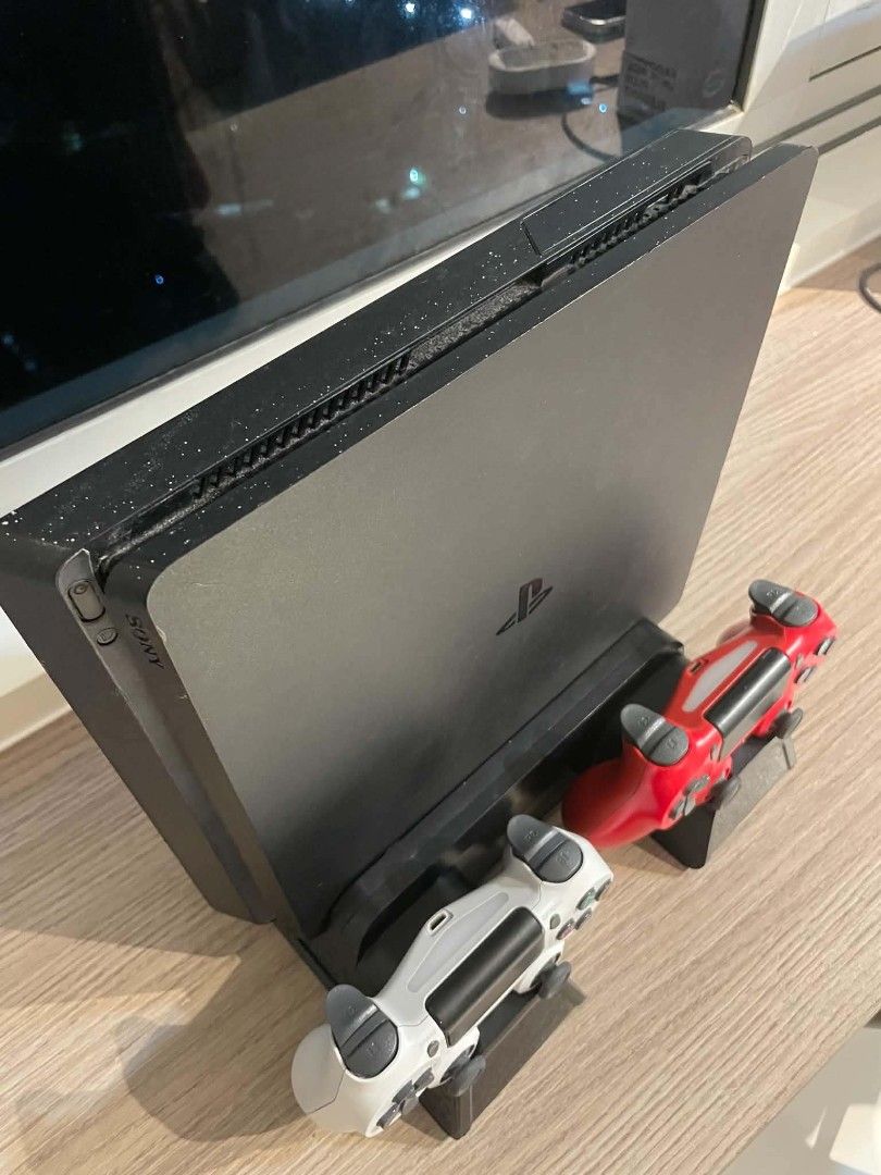 PlayStation 4 Slim Console with 2 Controllers and 8 Games (Category: PlayStation) located in Manila. Submitted by markfuna613361 (Listing ID 1466764651, Image 3). Description: Selling my PS4 complete gaming bundle. Everything is working and ready to play. Inclusions: PS4 1tb 13.5 (can be jailbreak) 2x Original Sony DualShock 4 controllers PS4 controller charging dock Controller charger/cable Power cable 8 original PS4 games: It Takes Two NBA 2K25