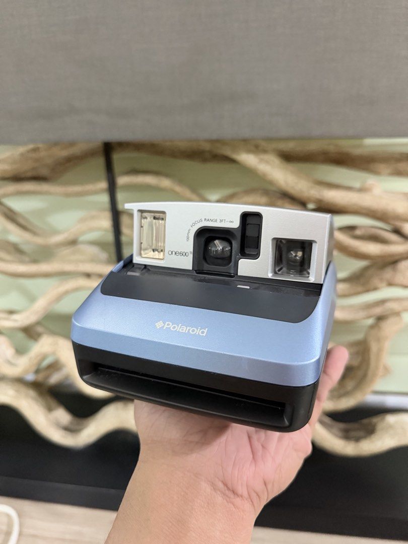Polaroid one600 Instant Film Camera (Category: Cameras) located in Pasig City. Submitted by iambernabe (Listing ID 1466713003, Image 1). Description: - Model: Polaroid one600 Instant Film Camera - Color: Blue and silver colorway - Lens: 100mm focus lens (ranges from 3 feet to infinity) - Flash: Built-in flash for low-light shooting - Film Type: Uses standard 600 type film - Extras: Original strap attached to the side - Condition: Clean body with 