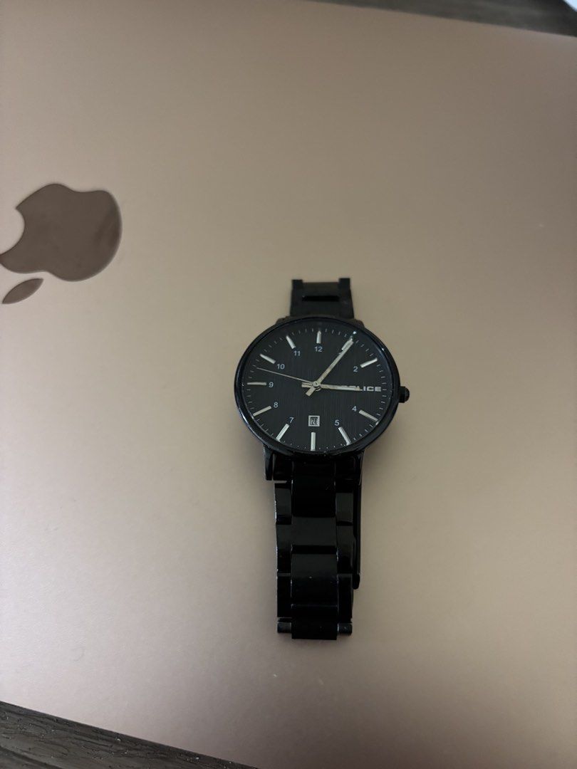 Police female watch (Category: Wearables & Smart Watches) located in Balayan. Submitted by authenticfindsbymrb (Listing ID 1466714722, Image 1). Description: - Brand: Police - Color: All-black (dial, case, and metal strap) - Features: Round dark face with white numerals/hands and date display window - Clasp: Secure fold-over clasp with engraved logo - Condition: 8/10, well-maintained with light signs of wear - Style: Versatile, sleek, and edgy ev