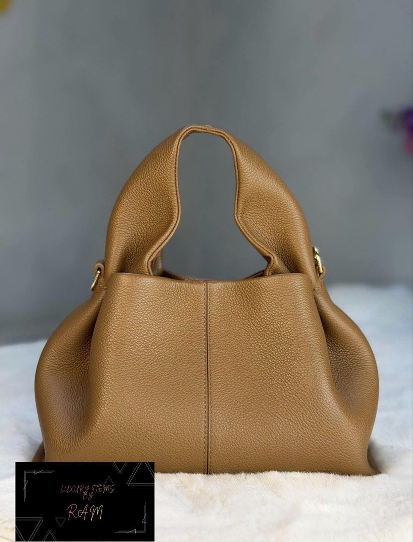 Polène Numéro Dix Tan Grained Leather Bag (Category: Luxury Bags & Wallets) located in Manila. Submitted by rhea.1215 (Listing ID 1466693793, Image 2). Description: - Brand: Polène Numéro Dix - Material: Premium textured tan grained leather - Design: Rounded hobo silhouette with a structured vertical center seam - Hardware: Elegant gold-tone with engraved branding - Interior: Spacious main compartment for your daily essentials - Versatility: Time