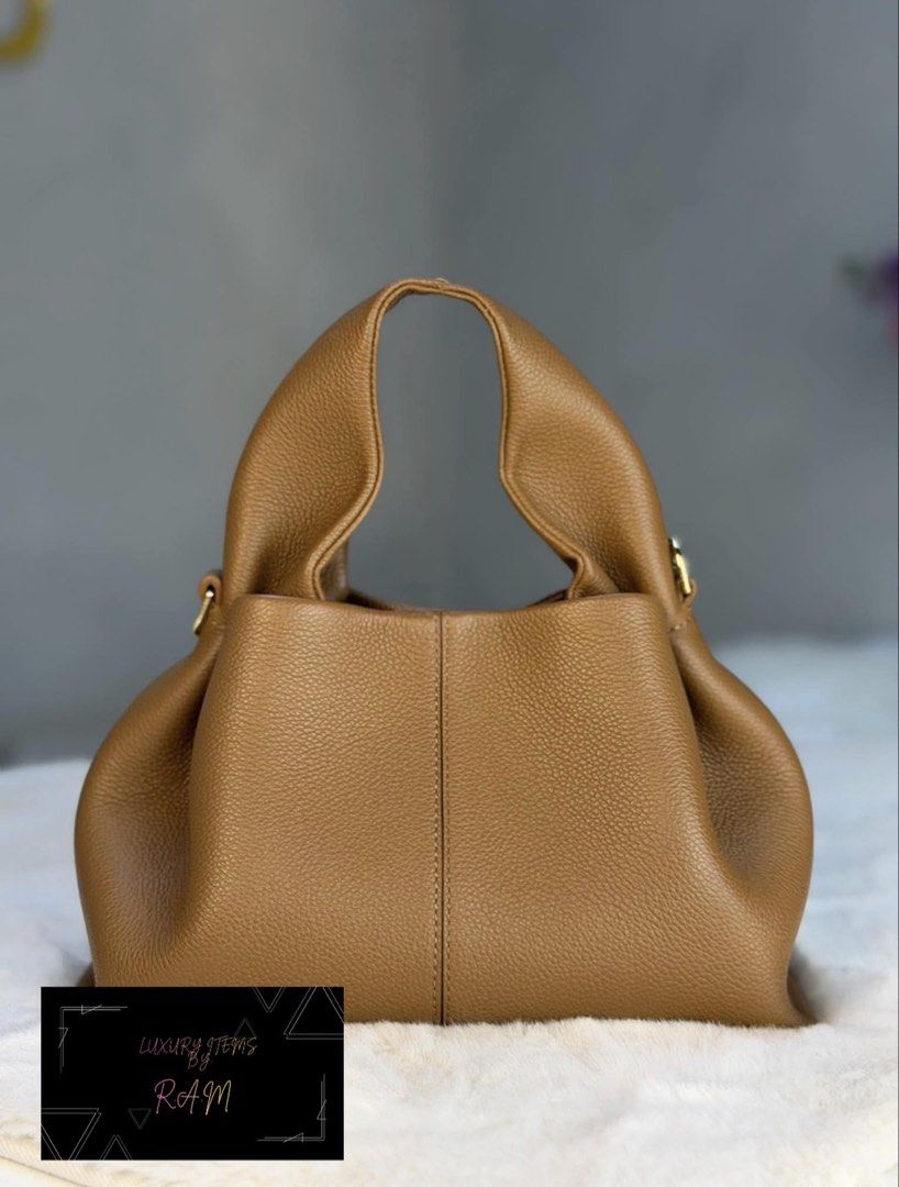 Polène Numéro Dix Tan Grained Leather Bag (Category: Luxury Bags & Wallets) located in Manila. Submitted by rhea.1215 (Listing ID 1466693793, Image 3). Description: - Brand: Polène Numéro Dix - Material: Premium textured tan grained leather - Design: Rounded hobo silhouette with a structured vertical center seam - Hardware: Elegant gold-tone with engraved branding - Interior: Spacious main compartment for your daily essentials - Versatility: Time