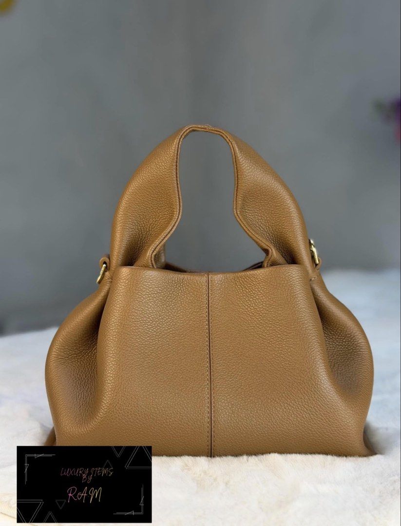 Polène Numéro Dix Tan Grained Leather Bag (Category: Luxury Bags & Wallets) located in Manila. Submitted by rhea.1215 (Listing ID 1466693793, Image 1). Description: - Brand: Polène Numéro Dix - Material: Premium textured tan grained leather - Design: Rounded hobo silhouette with a structured vertical center seam - Hardware: Elegant gold-tone with engraved branding - Interior: Spacious main compartment for your daily essentials - Versatility: Time