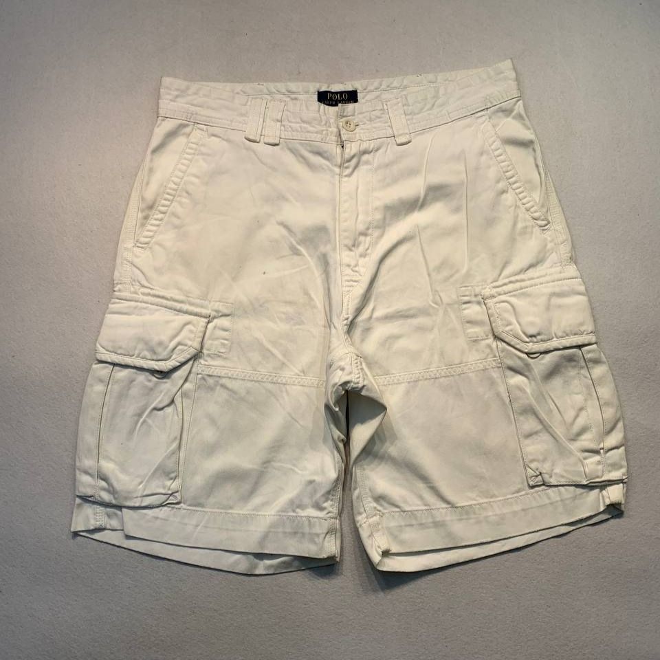 Polo Ralph Lauren White Cargo Shorts (Category: Shorts) located in Mandaluyong City. Submitted by theroom501 (Listing ID 1466683299, Image 1). Description: Polo Ralph Lauren White Cargo Shorts Style Code: Size on Tag: 34 Color: White Condition: Good pre-owned condition with a heavily distressed vintage look. Flaws/Issues: dots stain removable need wash. Flat Lay Measurements: Pit to Pit: 34 inches Length: 22 inches Leegopening Length: 12 inches P