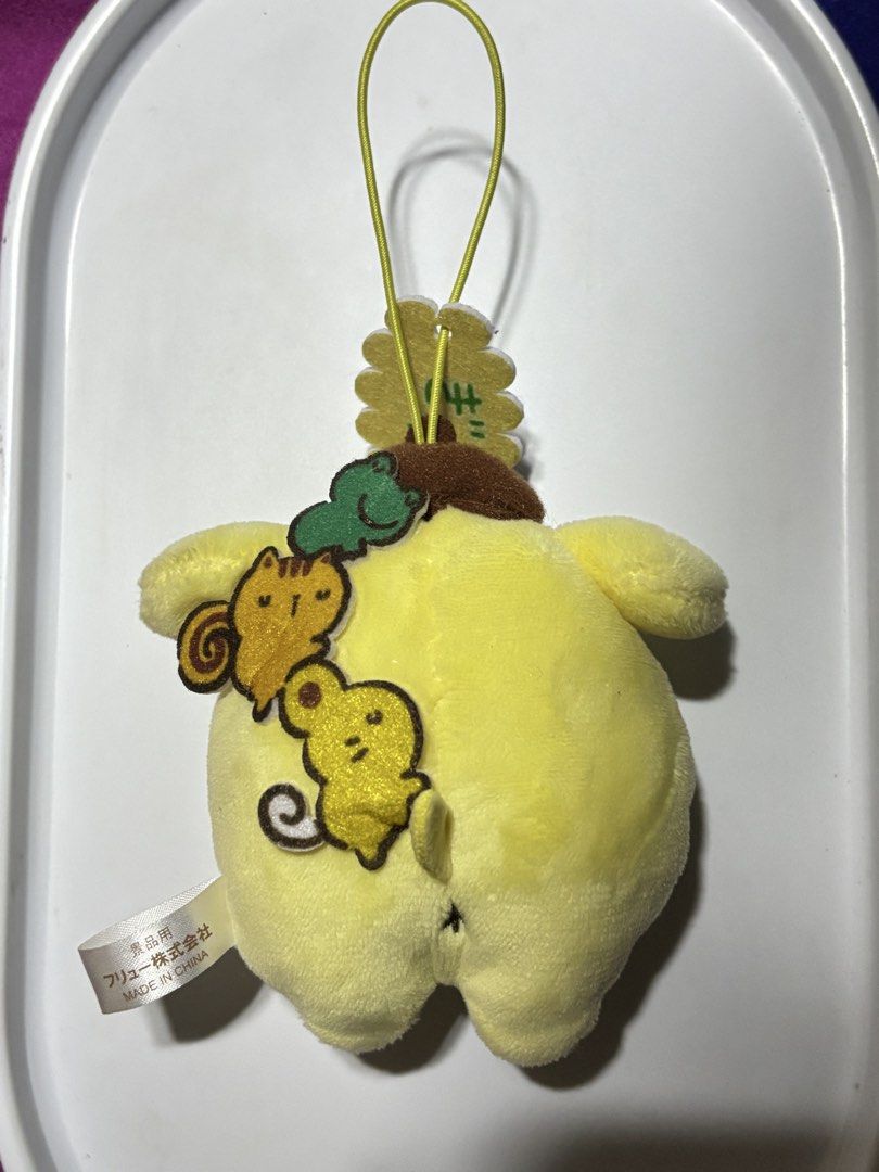 Pompompurin small plush charm (Category: Plushies & Soft Toys) located in Manila. Submitted by pmpmprn (Listing ID 1466608589, Image 1). Description: Authentic Sanrio Pompompurin with friends charm.
