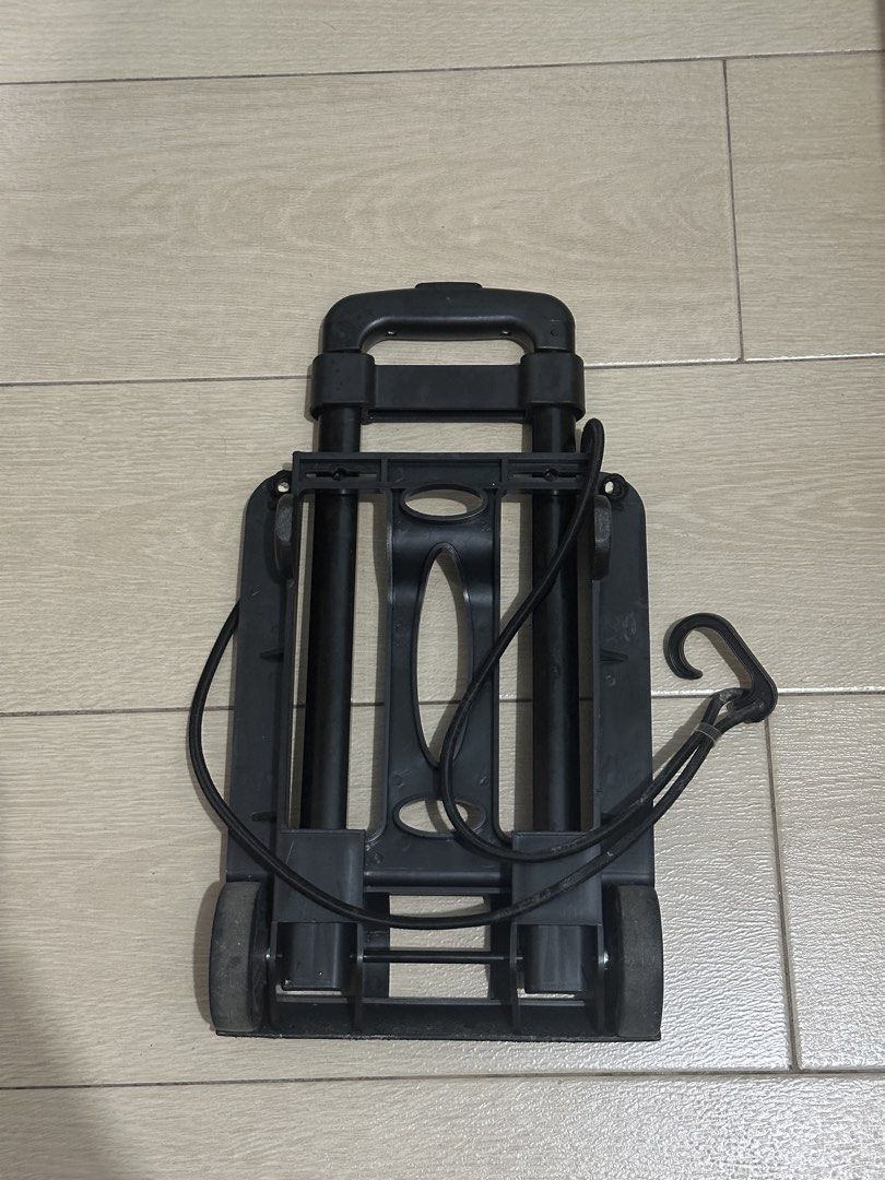 Portable folding trolley with hook (Category: Home Improvement Tools & Accessories) located in Mandaluyong City. Submitted by ireneangelinee (Listing ID 1466614319, Image 2). Description: - Compact folding trolley for boxes, luggage, and heavy bags - Folds flat for easy, space-saving storage - Includes a secure elastic bungee cord with hook to keep loads tied down - Lightweight and smooth-extending frame for effortless transport.