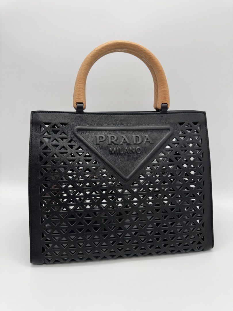 Prad@ Black Cutout Leather Tote Handbag (Category: Tote Bags) located in Calauan. Submitted by giftbags (Listing ID 1466763519, Image 2). Description: ❗️PLEASE READ CAREFULLY ❗️ Prada Cut Out Logo Tote in Black Size: L11.75 x H9 x W6.25 in Drop: 4 in With Dust bag STILL AVAILABLE/ONHAND? Yes. Item not marked as sold means available… 📌NO COD 📌NO LALAMOVE/GRAB 📌NO WHEN WORN 📌ITEMS ARE FOR SHIPPING ONLY - CUT OFF 12nn 📌ALL SALES ARE FINAL “WHAT