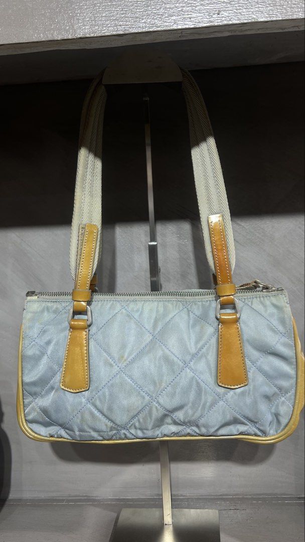 Prada (Category: Shoulder Bags) located in Manila. Submitted by source.selection (Listing ID 1466764735, Image 3). Description: This is a vintage Prada Tessuto Quilted Nylon Shoulder Bag in light blue featuring diamond-quilted nylon, patent leather trim, and the iconic silver-tone Prada triangular logo plaque..