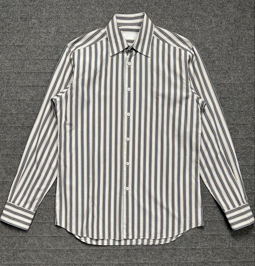 Prada - 00’s Rust Effect Stripes Button Down Shirt (Category: Formal Shirts) located in Manila. Submitted by scissor.2fifthy (Listing ID 1466572962, Image 1). Description: Prada - 00’s Rust Effect Stripes Button Down Shirt Tagged size: 38 fits Medium Men’s(see measurement) Made in Italy Material: 100% Cotton 85/100 condition rate Used with care Flaw: Minor sign of usage and small scratch (see last picture) Very presentable Check all photos for mo