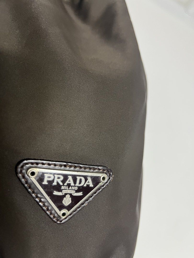 Prada Vintage Vela Wristlet Pouch (Category: Luxury Bags & Wallets) located in Manila. Submitted by merryjoyan39637 (Listing ID 1466699172, Image 3). Description: nylon body top drawstring closure black Condition: good Made in Italy Composition Outer: Nylon 100%.