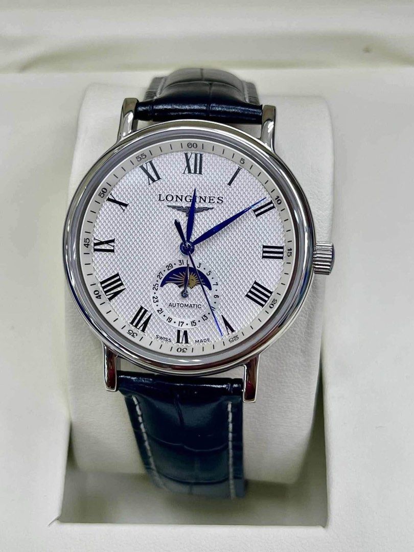 Preloved Watch Longines Master Collection Automatic Moonphase Watch (Category: Men's Watches) located in Manila. Submitted by bagsandmanymanymore1 (Listing ID 1466606559, Image 1). Description: - Brand/Model: Longines Master Collection Automatic -Size 40mm - Dial: Silver barleycorn with black Roman numerals, blued steel hands, and blue cabochon crown - Complications: Date and moonphase subdial at 6 o'clock - Movement: L899.4 automatic movement vi
