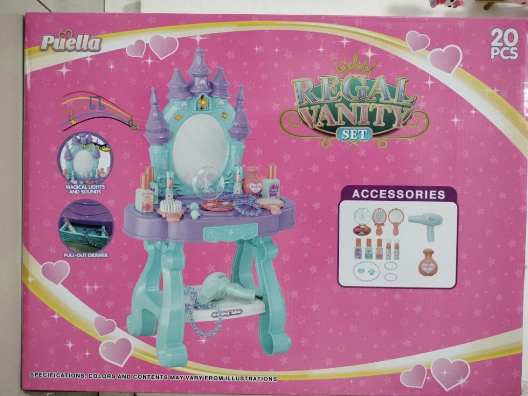 Puella Regal Vanity Set Toy Dressing Table (Category: Kids Toys) located in San Mateo. Submitted by shop_with_nicer (Listing ID 1466617020, Image 1). Description: - Magical castle-themed vanity set in fun pink, blue, and purple colors - Complete 20-piece set including a working toy hair dryer, pretend perfume, makeup, and jewelry - Features an interactive mirror with lights and sounds - Includes a convenient pull-out drawer for accessory storage 