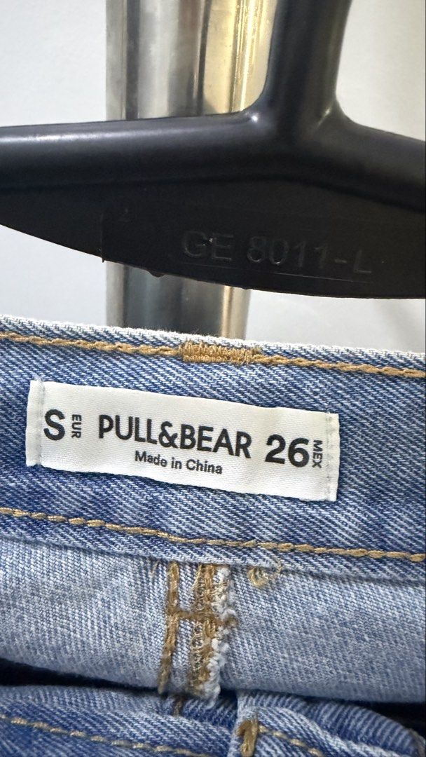 Pull & Bear Denim Skirt Size 26 S (Category: Skirts) located in Manila. Submitted by laxamanapa81165 (Listing ID 1466570219, Image 3). Description: Pull & Bear denim skirt in light wash blue. Size 26 EUR S MEX. Button front closure with metal buttons. Distressed details with ripped patches and frayed hems. Classic five pocket design. Tag intact..