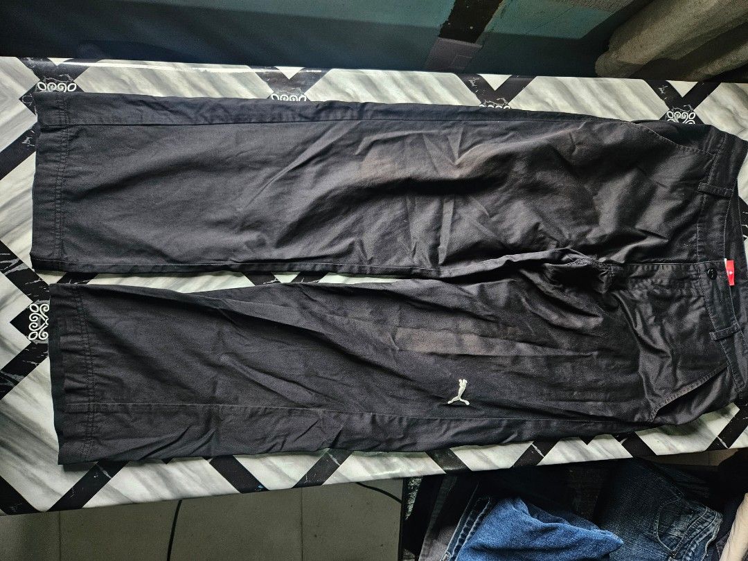 Puma Black Casual Pants Trousers (Category: Joggers) located in Manila. Submitted by shanshan.river (Listing ID 1466592743, Image 1). Description: - Brand: Puma - Color: Black - Fit: Straight leg, regular length - Details: Side pockets, back pockets with button flaps, button closure - Branding: Embroidered white Puma cat logo on upper leg - Fabric: Mid-weight, great for everyday casual wear - Condition: Excellent.