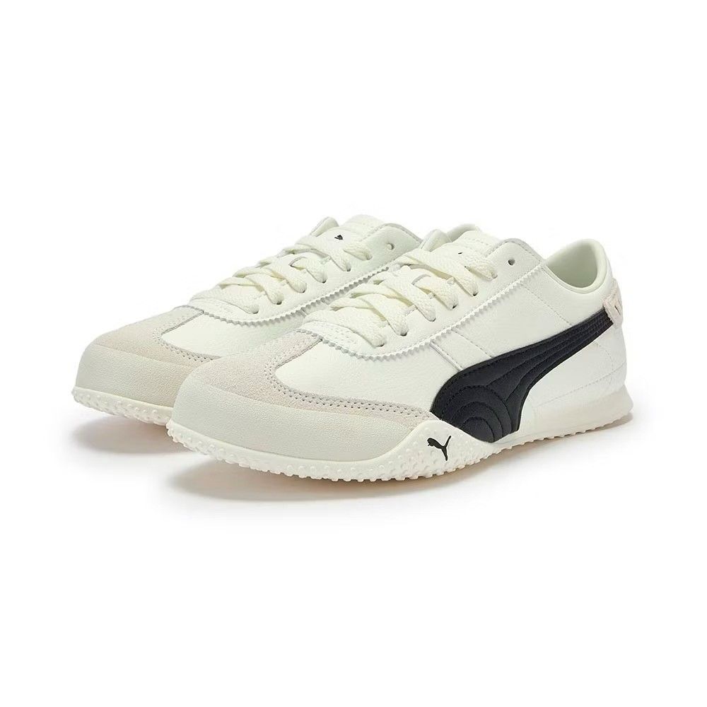 Puma Mostro White Black Sneakers (Category: Sneakers) located in Makati City. Submitted by vertaronda (Listing ID 1466698075, Image 1). Description: - Model: Puma Mostro Sneakers - Colorway: Cream White with Black Stripes - Upper: Clean white leather with suede toe cap overlay - Closure: Asymmetrical strap with traditional white laces - Outsole: Distinctive spiked rubber outsole wrapping up the toe - Comfort: Padded collar and soft insoles - Deta